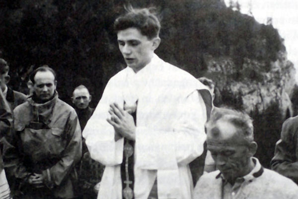 The Rev. Joseph Ratzinger praying during an open-air Mass near Ruhpolding, West Germany, in 1952. - Agence France-Presse — Getty Images