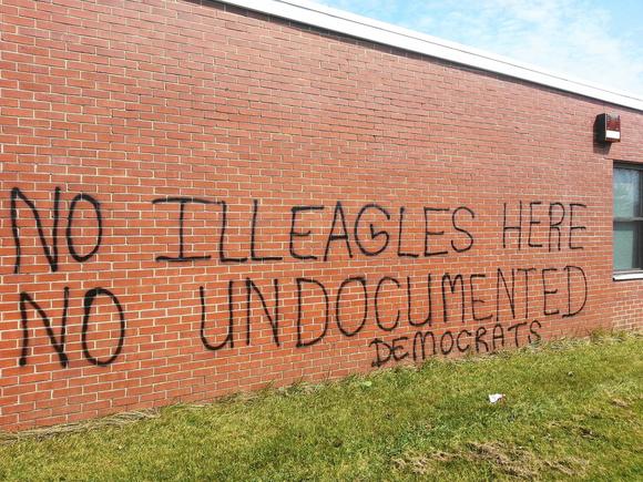  Maryland State Police have classified anti-immigration graffiti spray-painted July 13, 2014, on the former Army Reserve Center in Westminster, Md., as a hate crime. The facility recently became embroiled in controversy when the Obama administration considered using it to house immigrant children caught crossing the US-Mexico border illegally. (Christian Alexandersen, Baltimore Sun Media Group / July 14, 2014) 